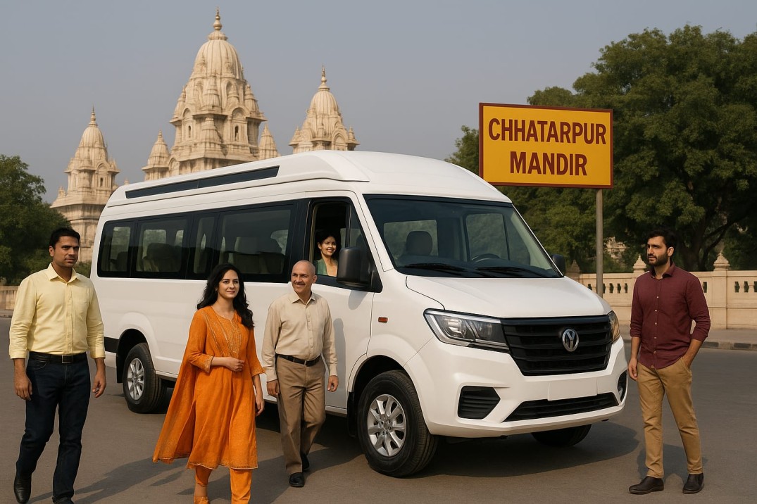 alt="White luxury Tempo Traveller van parked near chattarpur mandir metro station with overhead metro tracks and a green road sign displaying 'CHATTARPUR MANDIR'."